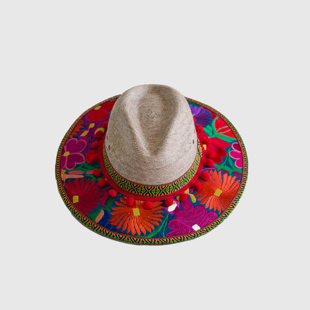 Hat decorated with red embroidered flowers