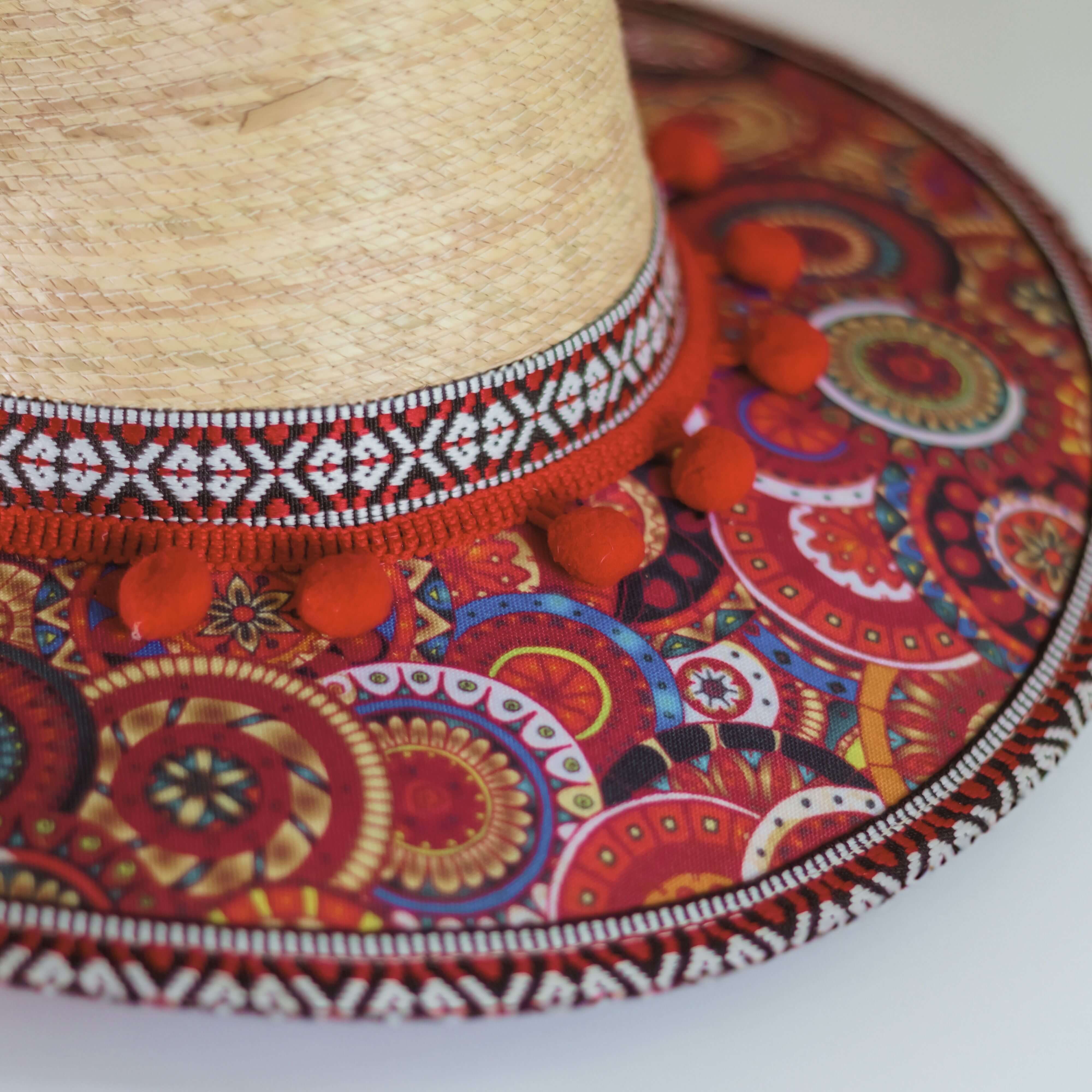 Hat decorated with red pompom