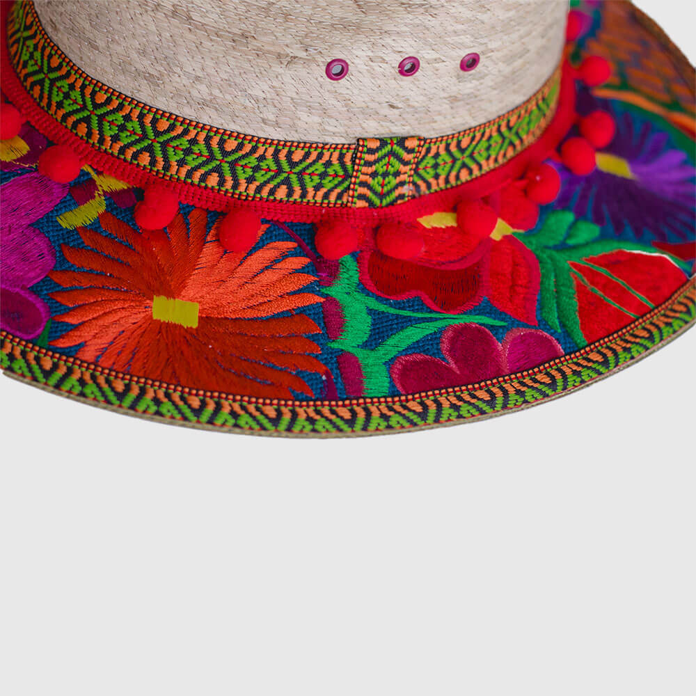 Hat decorated with red embroidered flowers