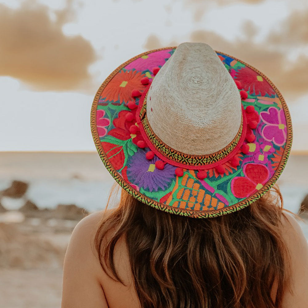 Hat decorated with red embroidered flowers