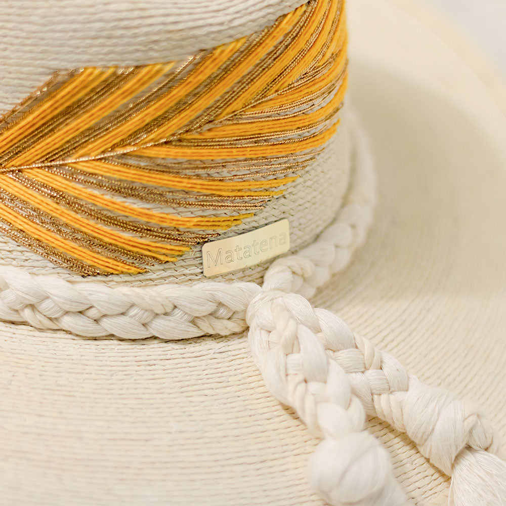 Hand embroidered hat with cotton and palm threads, yellow / Gold feather